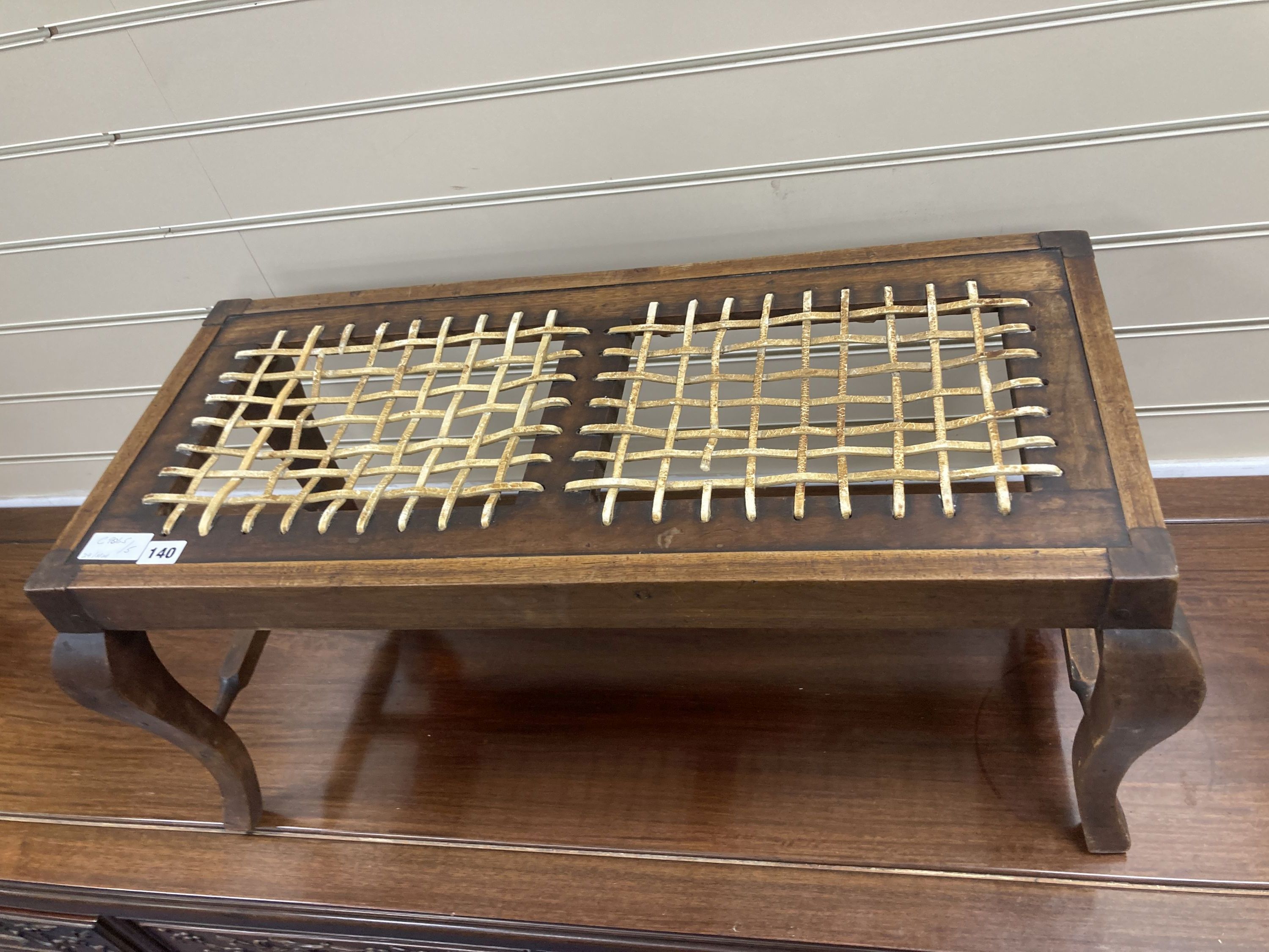 An early 20th century mahogany framed luggage stool with woven strapwork top, 35cm high, width 76cm, depth 34cm